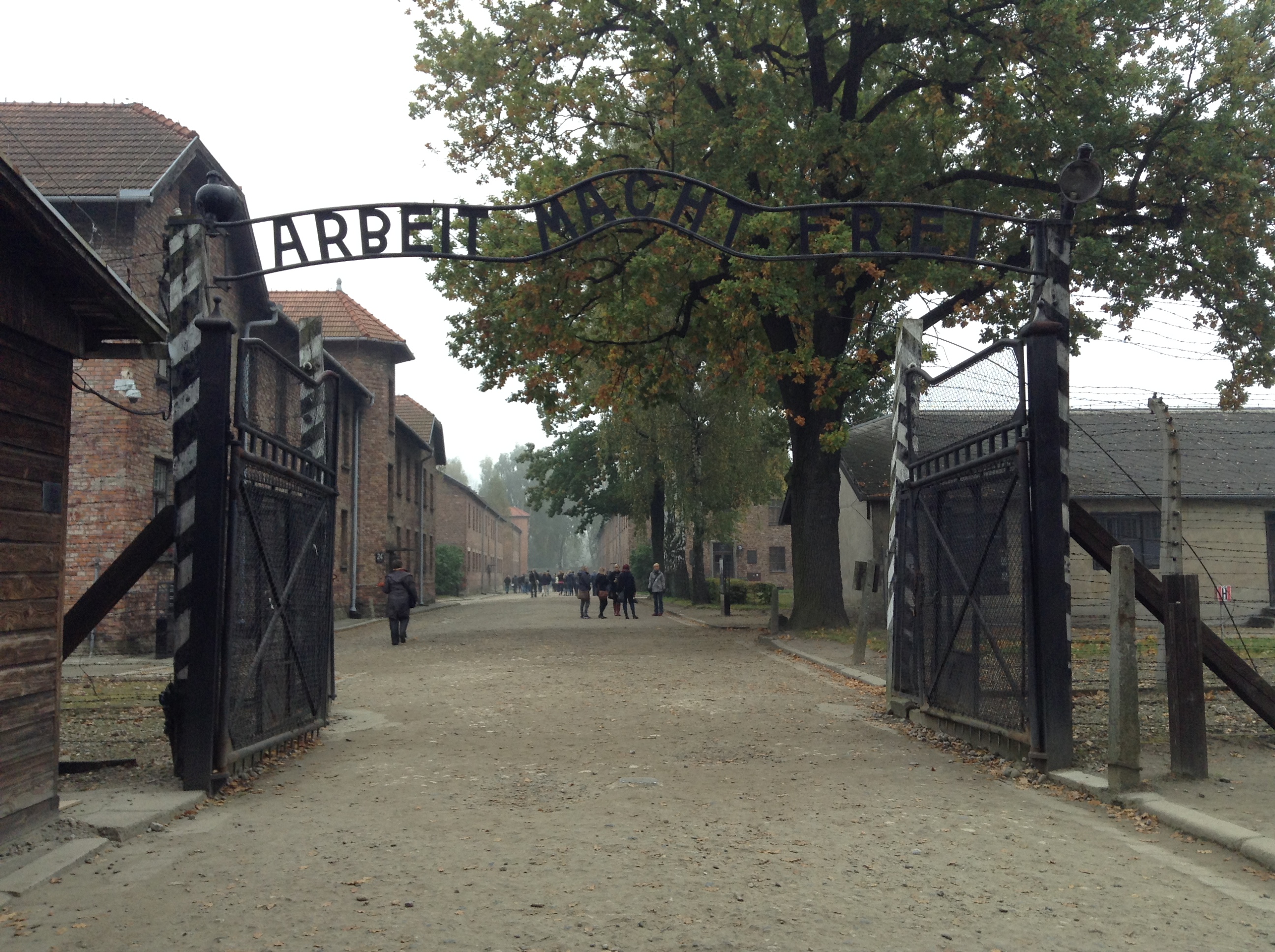 Gates leading to Auschwitz concentration camp: sign reads "Work makes (you) free"